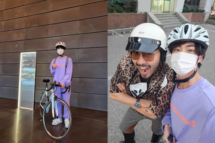 Jin BTS menunjukkan potretnya usai ke gedung HYBE